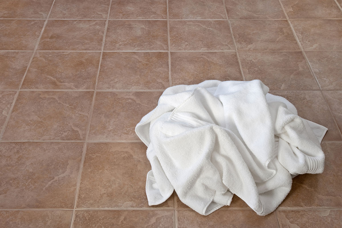 Soggy towel on floor